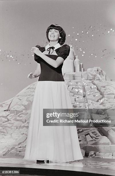 French singer Mireille Mathieu performs on the television program Numero 1. Mathieu was a popular entertainer in the 1960s and 1970s.