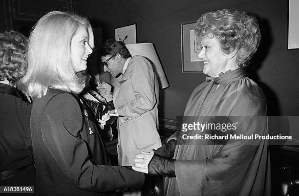 Edwige Feuillere greets fellow actress Catherine Deneuve on the opening night of Dear Liar, which featured Feuillere. The play, going under the title...