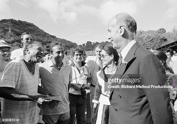 The French Presidential couple, Valery Giscard d'Estaing and his wife Anne-Aymone d'Estaing, share a joke with Guyanese-born Guadeloupean singer...