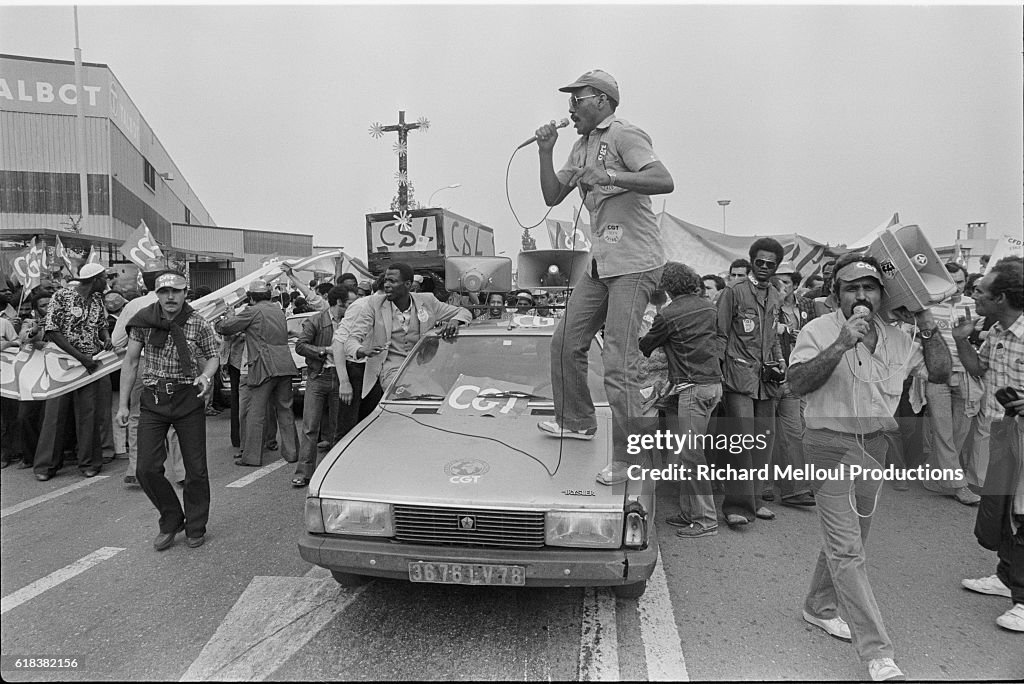 Worker Standing on Car During Strike in France