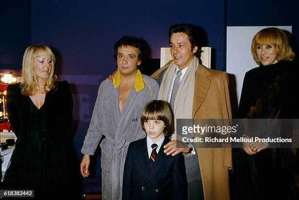 French actors Mireille Darc and Alain Delon backstage with singer Michel Sardou, his wife Babette and their son Romain after his premiere at the...