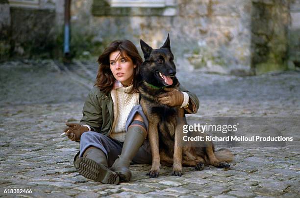 Princess Caroline of Monaco with her pet German shepherd at the royal Grimaldi family's French villa. Two months earlier, Princess Grace, formerly...