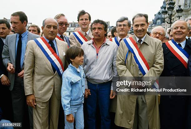 French singer Michel Sardou and his son Romain attend a demonstration in favor of private schooling with Jean-Pierre Bloch and Charles Pasqua in...