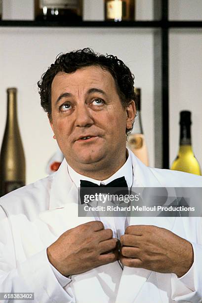 Comedian Coluche on Show Sardou