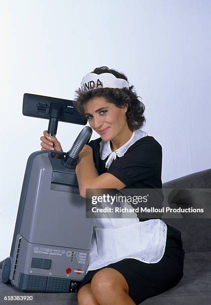 Portuguese singer Linda de Suza wears a maid costume in a commercial for vacuum cleaners in Paris.