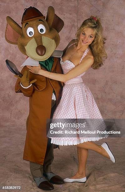 French singer Douchka poses with Basil of Baker Street, a mouse character from Disney's 1986 animation The Great Mouse Detective. Douchka was the...