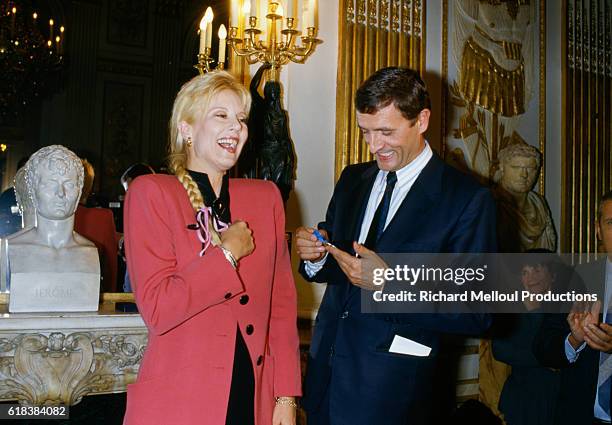 Popular French singer Sylvie Vartan is made a member the Ordre National du Merite by French minister of culture Francois Leotard. The Ordre National...