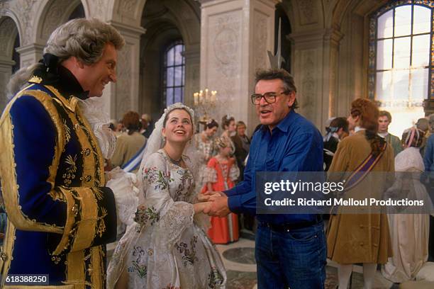 Czech director Milos Forman directs actor Jeffrey Jones and young actress Fairuza Balk on the set of the film Valmont in Paris. The film is set in...