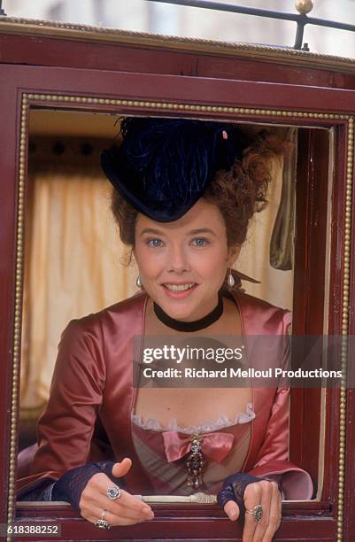 American actress Annette Bening looks out the window of a carriage on the Bordeaux set of the film Valmont directed by Czech director Milos Forman....