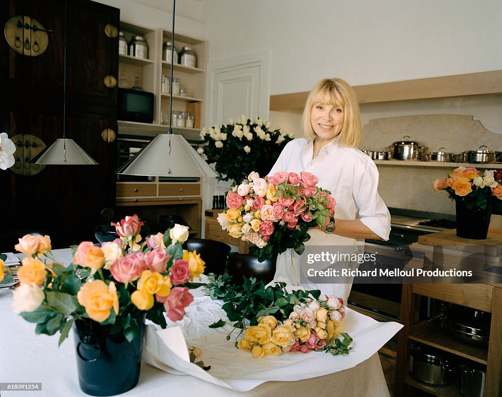 Actress Mireille Darc Arranging Flowers