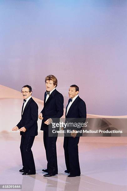French singers Marcel Zanini, Eddy Mitchell and Henri Salvador record a Christmas-special television show.