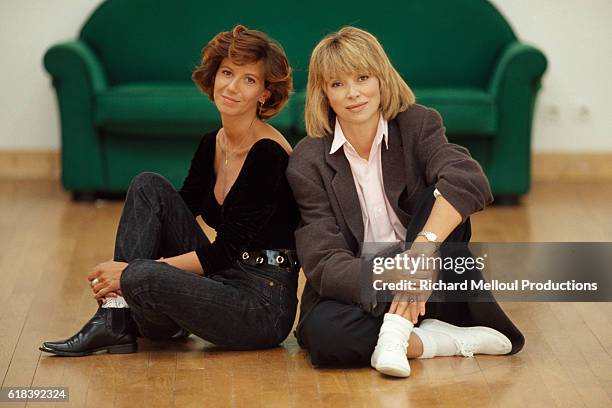 French actresses Fiona Gelin and Mireille Darc on the set of singer and songwriter Michel Sardou's music video for his song "Marie-Jeanne".