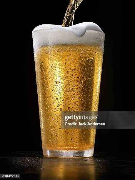 beer splash - beer glass stock pictures, royalty-free photos & images