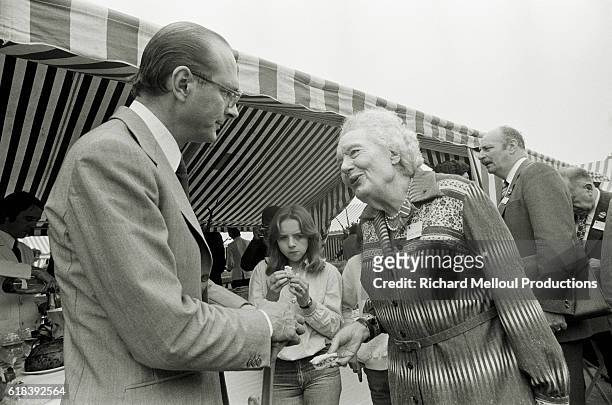 French Mayor of Paris and President of the Rally for the Republic Jacques Chirac with author, journalist, feminist and European politician Louise...