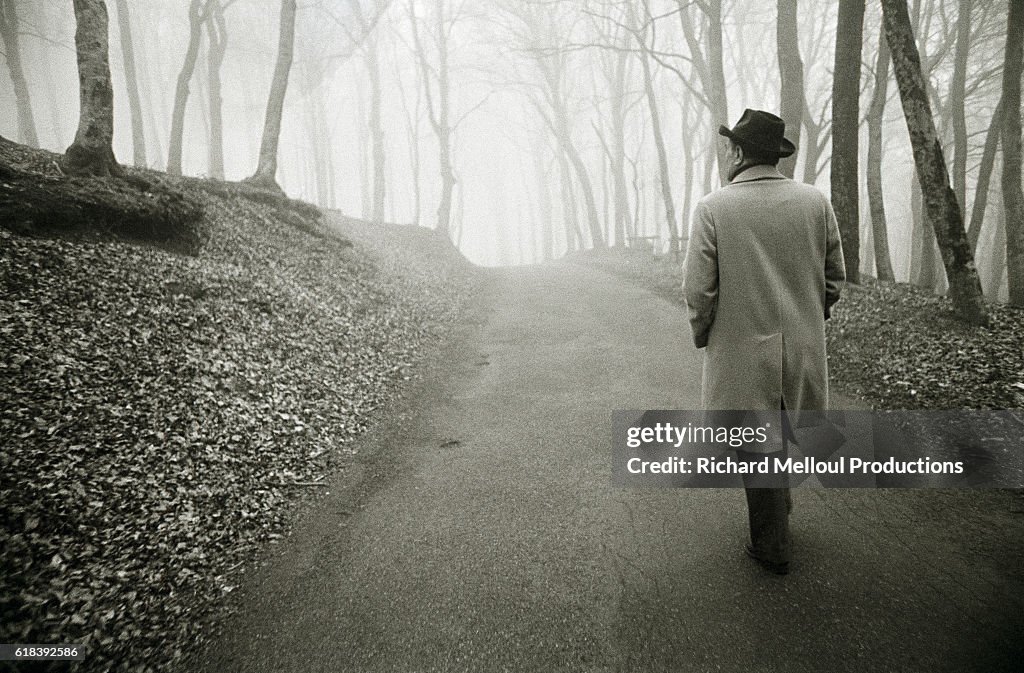 François Mitterrand walking in country