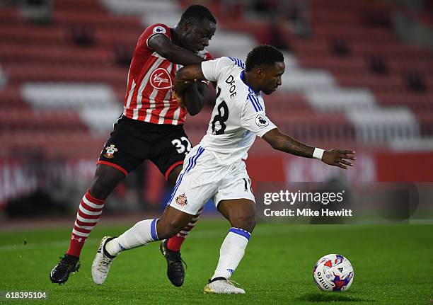 Olufela Olomola of Southampton and Jermain Defoe of Sunderland battle for possession during the EFL Cup fourth round match between Southampton and...