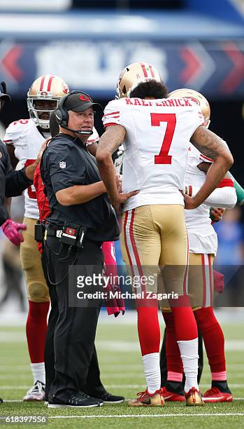 Head Coach Chip Kelly and Colin Kaepernick of the San Francisco 49ers talk on the field during the game against the Buffalo Bills at New Era Field on...