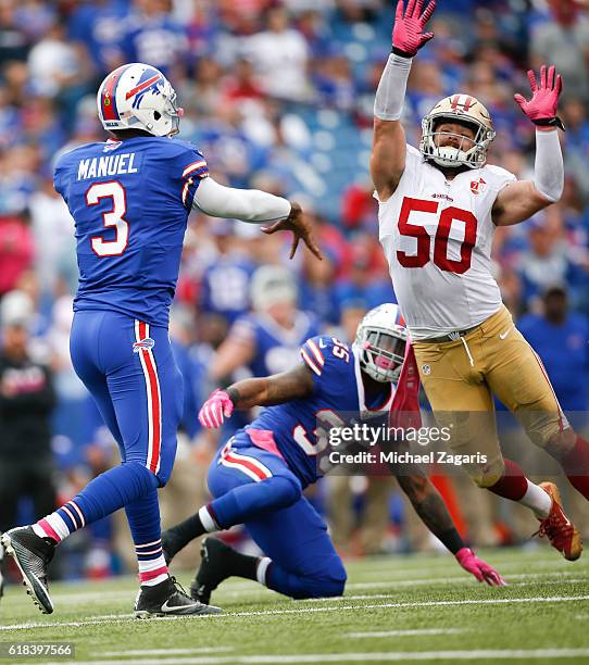 Nick Bellore of the San Francisco 49ers pressures Tyrod Taylor of the Buffalo Bills during the game at New Era Field on October 16, 2016 in Orchard...