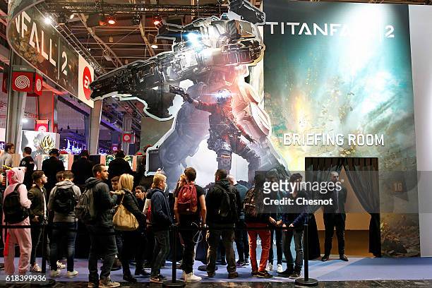 People queue to play the video game 'Titanfall 2' developed by Respawn Entertainment and published by Electronic Arts during the "Paris Games Week"...