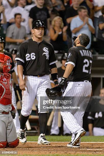 Chicago White Sox Designated hitter Avisail Garcia [6604] meets Chicago White Sox Catcher Dioner Navarro [3668] at the plate after Navarro hits a two...