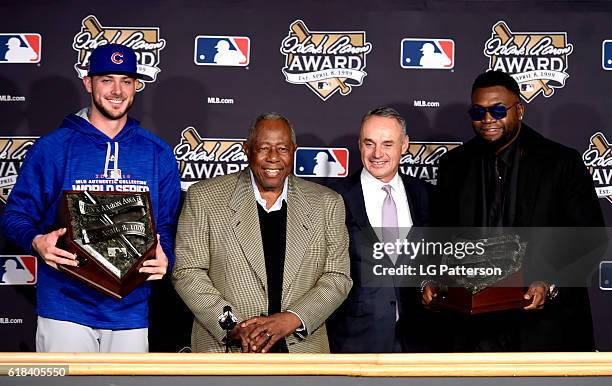 Hank Aaron Award recipients Kris Bryant of the Chicago Cubs and David Ortiz of the Boston Red Sox pose for a photo with Hall of Famer Hank Aaron and...