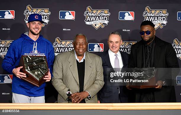 Hank Aaron Award recipients Kris Bryant of the Chicago Cubs and David Ortiz of the Boston Red Sox pose for a photo with Hall of Famer Hank Aaron and...