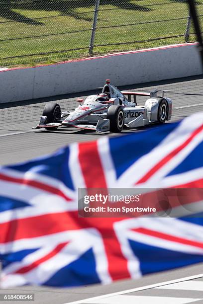 Will Power driver of the Verizon Team Penske Chevrolet races down the front stretch, past a Union Jack flag, honoring the loss of Justin Wilson,...