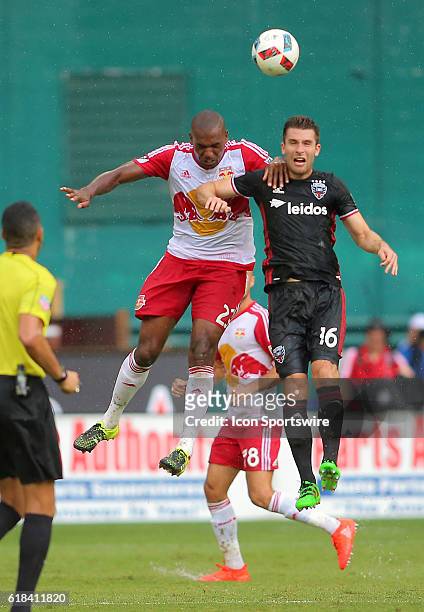 New York Red Bulls defender Ronald Zubar goes for a header with D.C. United forward Patrick Mullins during a MLS match at RFK Stadium, in Washington...