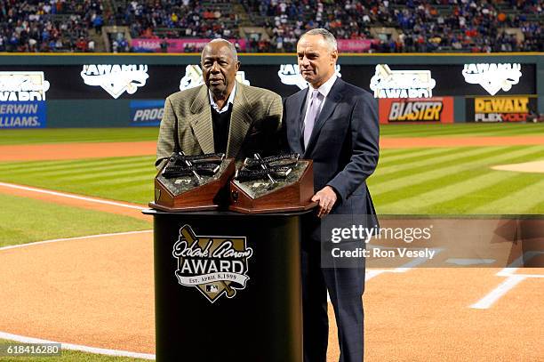 Hall of Famer Hank Aaron and Major League Baseball Commissioner Robert D. Manfred Jr. Pose for a photo on the field prior to Game 2 of the 2016 World...