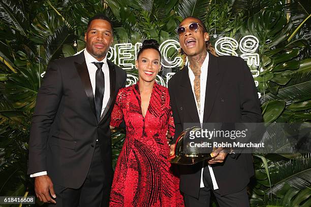 Michael Strahan, Grace Raymond, and Wiz Khalifa attend the Pencils of Promise 6th Annual Gala "A World Imagined" at Cipriani Wall Street on October...