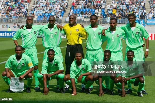 Nigeria line up for the pre-match team photo before the Group F match against Argentina of the World Cup Group Stage played at the...