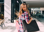 Woman enjoying the weekend in the shopping mall
