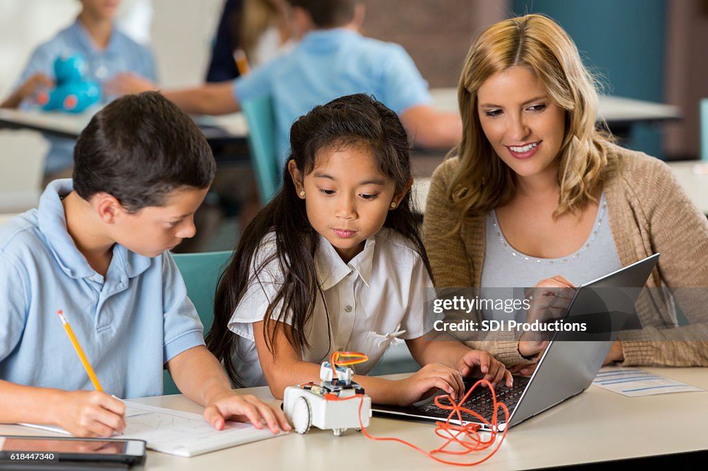 STEM private school students concentrate on robotics project