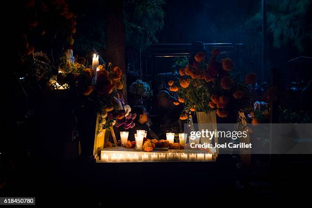 day of the dead grave at night in oaxaca, mexico - day of the dead stock pictures, royalty-free photos & images