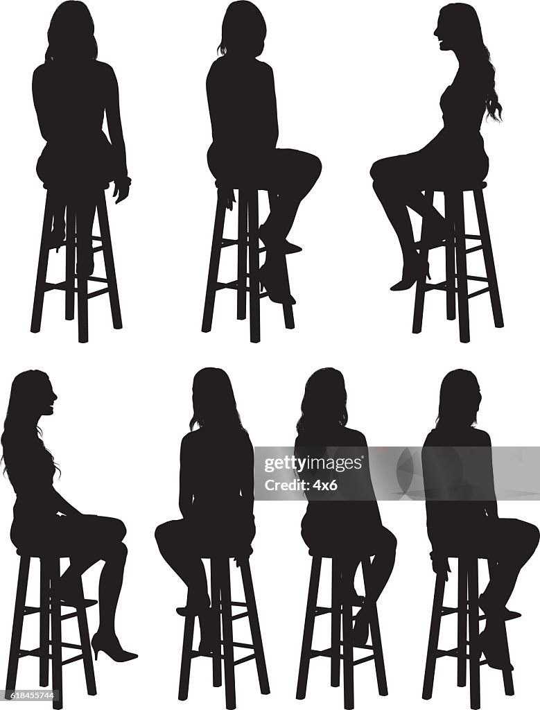 Woman sitting on stool