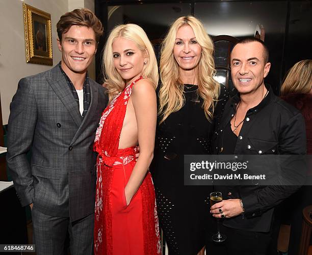 Oliver Cheshire, Pixie Lott, Melissa Odabash and Julian Macdonald attend a private dinner at Mr Chow hosted by will.i.am and brother Carl Gilliam to...