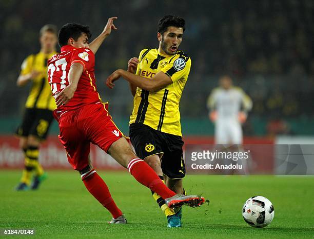 Nuri Sahin of Borussia Dortmund in action with Eroll Zejnullahu of 1.FC Union Berlin during the DFB Pokal soccer match between Borussia Dortmund and...