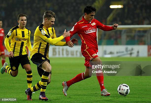 Lukasz Piszczek of Borussia Dortmund in action with Eroll Zejnullahu of 1.FC Union Berlin during the DFB Pokal soccer match between Borussia Dortmund...