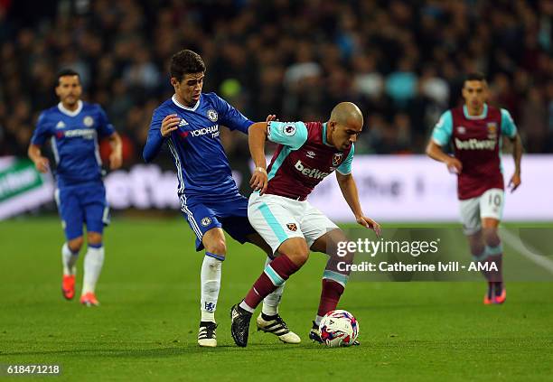 Oscar of Chelsea and Sofiane Feghouli of West Ham during the EFL Cup fourth round match between West Ham and Chelsea at The London Stadium on October...