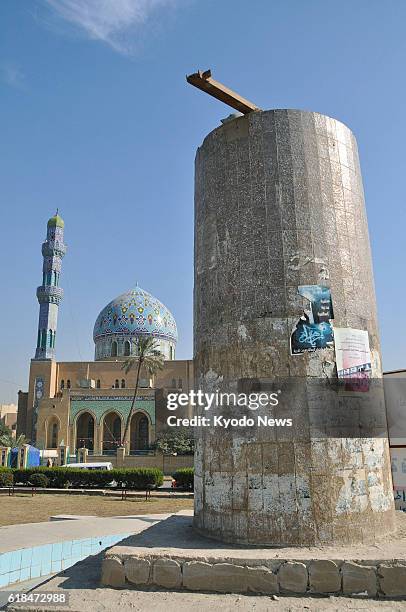 Iraq - Only the base of a statue of former Iraqi President Saddam Hussein remains in a square in central Baghdad on Dec. 8 after the statue was...