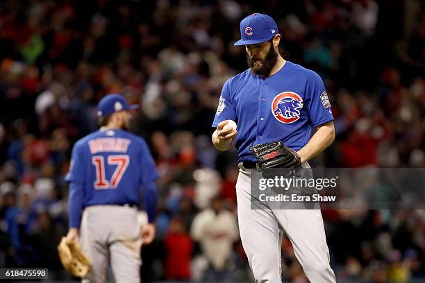 Jake Arrieta of the Chicago Cubs reacts on the pitcher's mound after a double by Jason Kipnis of the Cleveland Indians during the sixth inning in...