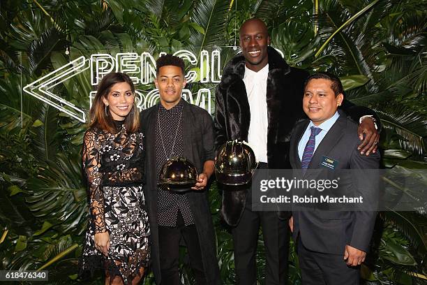 Nico Sereba and Vincent Dery of Nico & Vinz are presented with the Gold Construction Helmet signifying a PoP school to be built in their honor by...