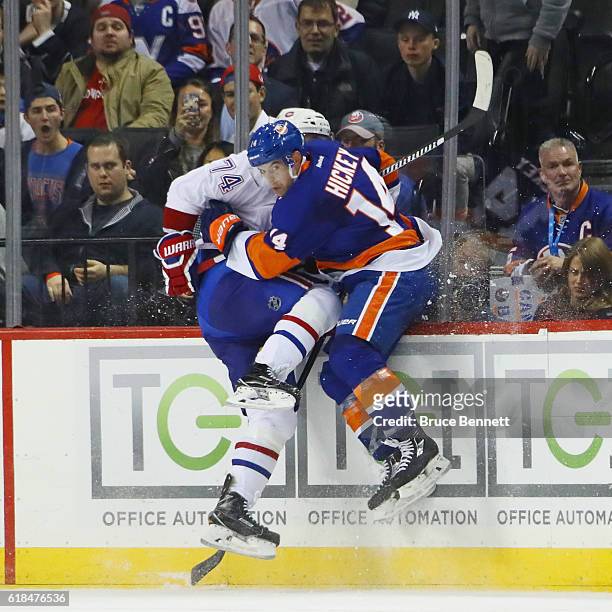 Thomas Hickey of the New York Islanders checks Alexei Emelin of the Montreal Canadiens during the third period at the Barclays Center on October 26,...