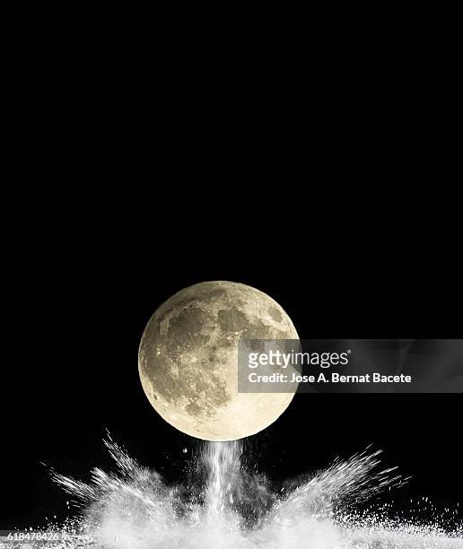 explosion of dust particles by the impact of the full moon - massive ordnance air blast bomb stock pictures, royalty-free photos & images