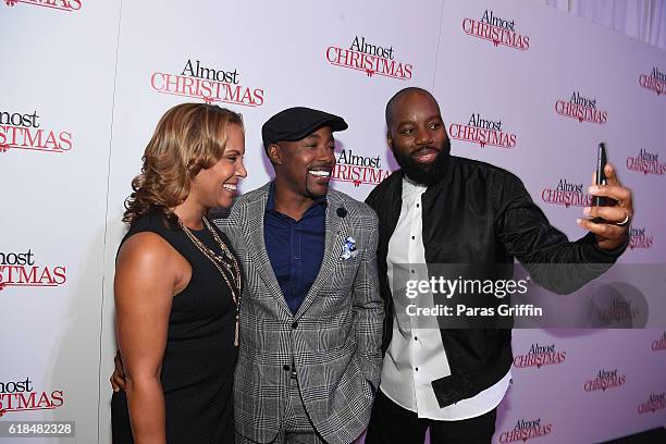 Heather Packer, Will Packer and David E. Talbert attend "Almost Christmas" Atlanta screening at Regal Cinemas Atlantic Station Stadium 16 on October...