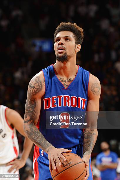 Michael Gbinije of the Detroit Pistons shoots a free throw against the Toronto Raptors on October 26, 2016 at the Air Canada Centre in Toronto,...
