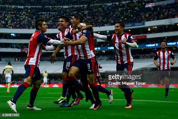 Alan Pulido of Chivas celebrates after scoring the first goal of his team during the semifinal match between America and Chivas as part of the Copa...
