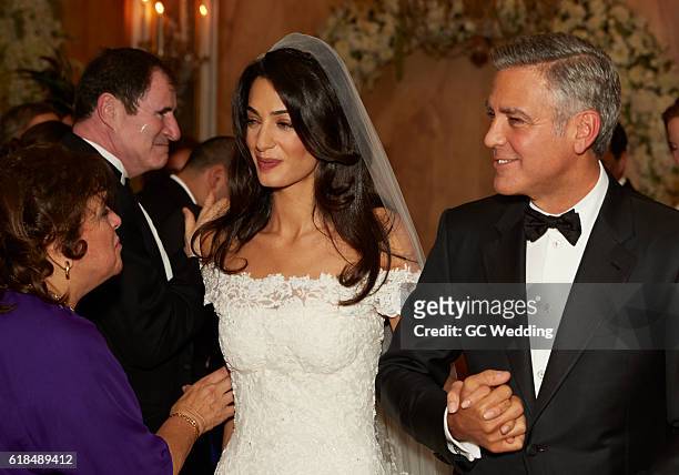 Amal Alamuddin and George Clooney with mother of bride Baria Alamuddin and actor Richard Kind at the George Clooney and Amal Alamuddin Wedding on...