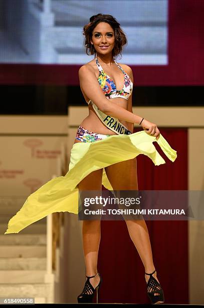 Miss France Khaoula Najine poses in her swimwear during a rehearsal for the Miss International beauty pageant final in Tokyo on October 27, 2016. /...