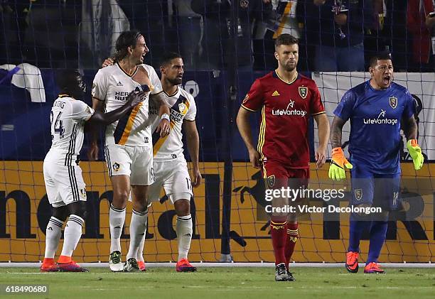 Ema Boateng, Alan Gordon and Sebastian Lletget of Los Angeles Galaxy celebrate Gordon's goal as Chris Wingert and goalkeeper Nick Rimando of Real...